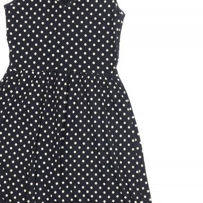 Brand and care label for Only women’s black polka dot polyester a-line, size S, round neck pullover