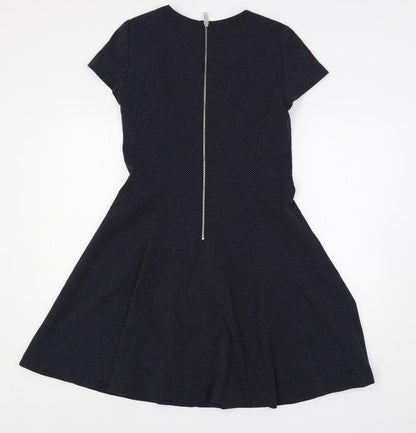 Back view of ESPRIT women’s blue polka dot polyester fit & flare, size UK 10, round neck zip