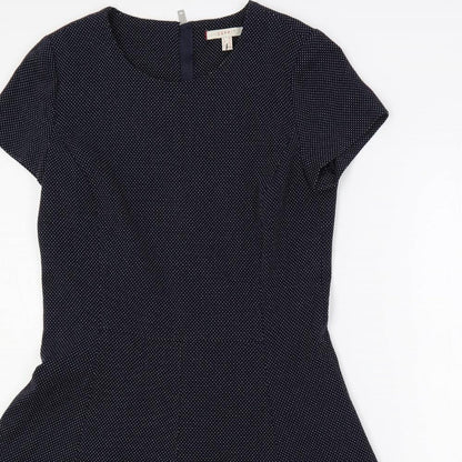 Close-up detail of ESPRIT women’s blue polka dot polyester fit & flare, size UK 10, round neck zip