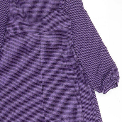 Brand and care label for ASOS women’s purple houndstooth polyester fit & flare, size UK 4, scoop neck pullover