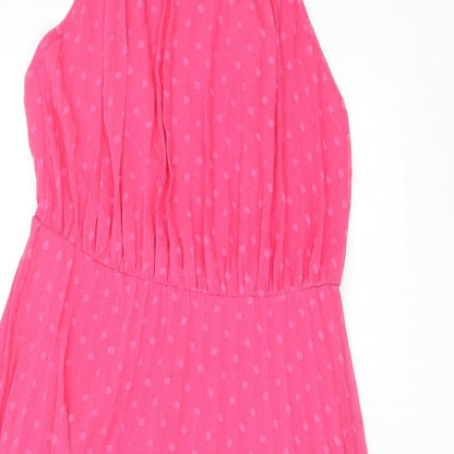 Close-up detail of ASOS women’s pink polka dot polyester a-line, size UK 10, halter zip - open back