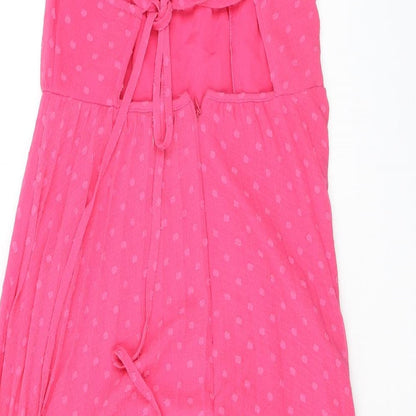 Brand and care label for ASOS women’s pink polka dot polyester a-line, size UK 10, halter zip - open back