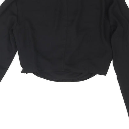 Brand and care label for Miss Selfridge women’s black polyester cropped blouse, size UK 6, round neck