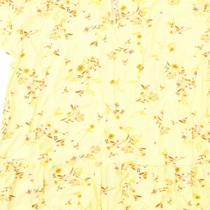 Brand and care label for C&A women’s yellow floral cotton basic blouse, size UK 6, round neck