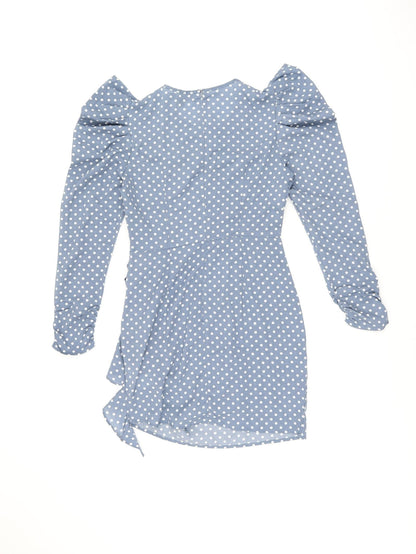 Back view of Missguided women’s blue polka dot polyester bodycon, size UK 8, round neck zip
