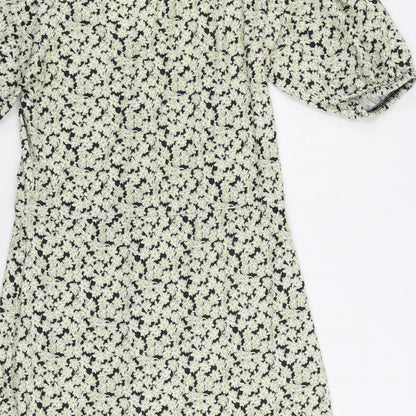 Brand and care label for ASOS women’s green floral cotton a-line, size UK 10, v-neck pullover - ruffle