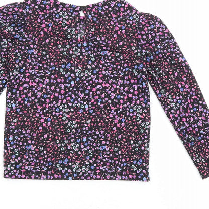 Brand and care label for Dunnes girls’ black floral polyester basic blouse, size 4-5, years round neck button