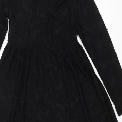 Brand and care label for JDY women’s black polyester a-line, size S, round neck pullover - textured