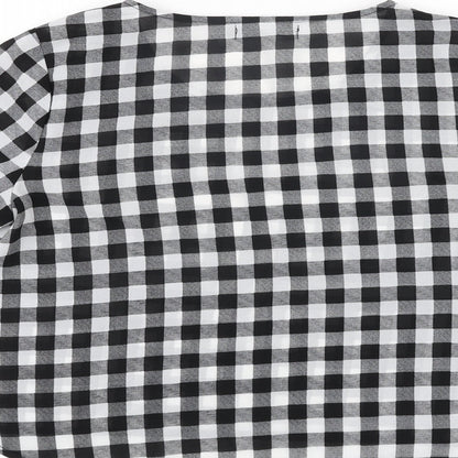 Brand and care label for Missguided women’s black check polyester basic blouse, size UK 10, round neck