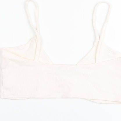 Brand and care label for Missguided women’s pink polyester cropped tank, size UK 12, v-neck