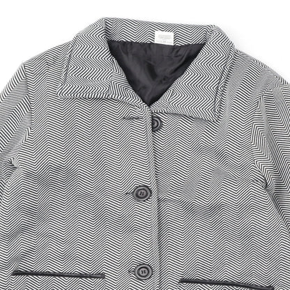 Close-up detail of Anne De Lancay women’s black geometric jacket, size UK 12, button
