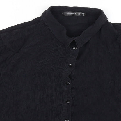 Close-up detail of Missguided women’s black viscose basic blouse, size UK 10, collared