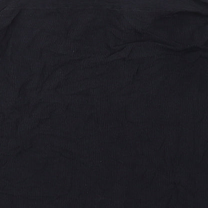 Brand and care label for Missguided women’s black viscose basic blouse, size UK 10, collared