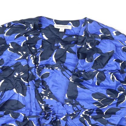Close-up detail of Autograph women’s blue geometric viscose wrap blouse, size M, v-neck