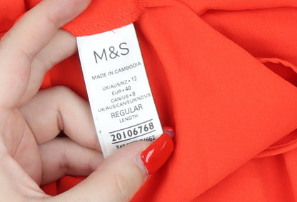 Close-up detail of Marks & Spencer Orange Cap Sleeve Blouse, size 12