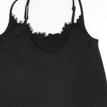 Brand and care label for Missguided women’s black polyester camisole t-shirt, size UK 4, v-neck