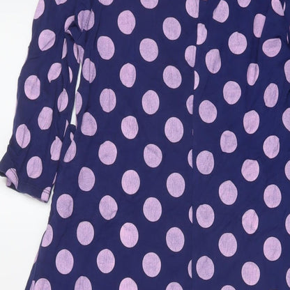 Brand and care label for ASOS women’s purple polka dot viscose a-line, size UK 8, v-neck pullover