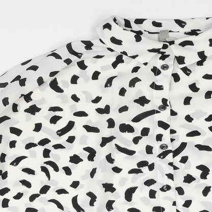 Close-up detail of ASOS women’s white geometric polyester basic button-up, size UK 14, collared