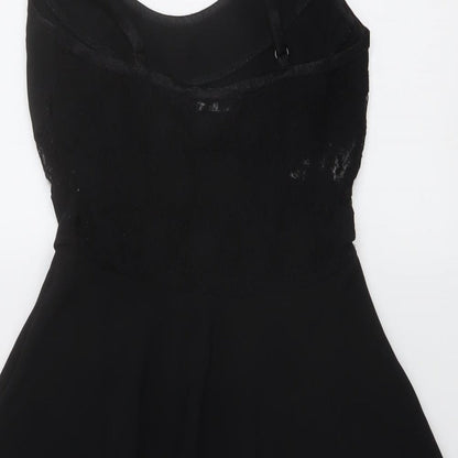Brand and care label for Miss Selfridge women’s black polyester skater dress, size UK 6, round neck pullover