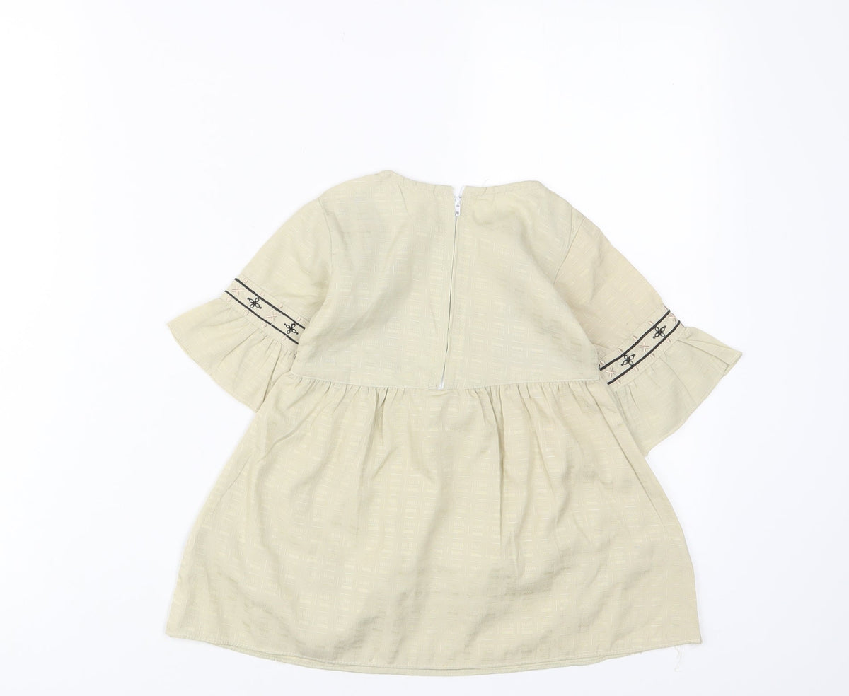 Back view of Attitude girls’ beige fair isle cotton a-line, size 18, months crew neck zip - embroidered