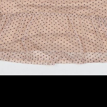 Brand and care label for Next girls’ beige polka dot polyester basic blouse, size 9-12, months round neck button