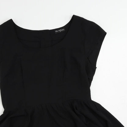 Close-up detail of Miss Selfridge women’s black polyester basic blouse, size UK 10, boat neck - peplum