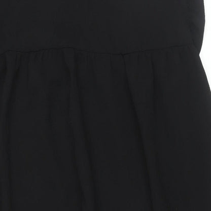Close-up detail of ASOS women’s black polyester shift, size UK 8, round neck button - smocked frill