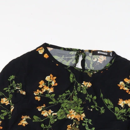 Close-up detail of Missguided women’s black floral polyester basic blouse, size UK 8, round neck