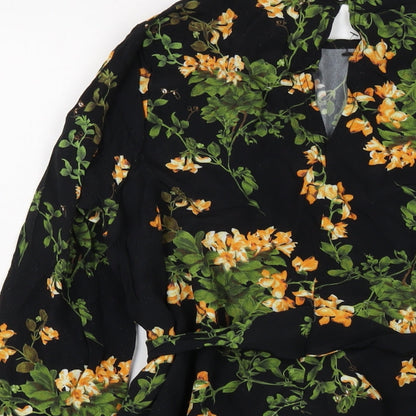Brand and care label for Missguided women’s black floral polyester basic blouse, size UK 8, round neck