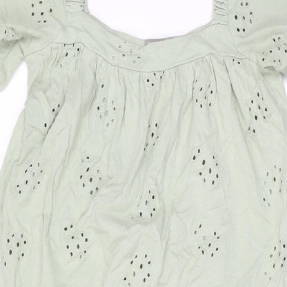 Close-up detail of ASOS women’s green cotton shift, size UK 8, square neck pullover