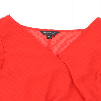 Close-up detail of Miss Selfridge women’s red polka dot polyester basic blouse, size UK 12, v-neck