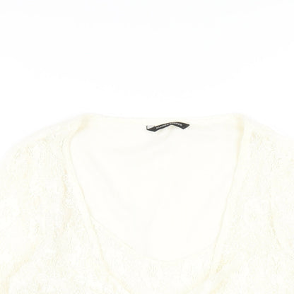 Close-up detail of Dunnes women’s ivory nylon basic t-shirt, size UK 14, round neck