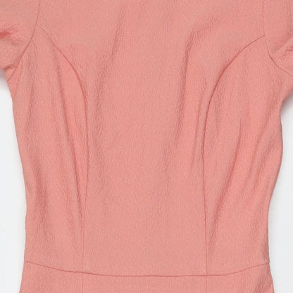 Close-up detail of ASOS women’s pink polyester mermaid, size UK 10, crew neck zip