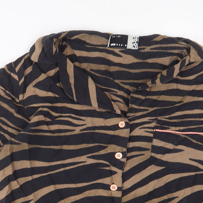 Close-up detail of ASOS women’s brown animal print viscose basic button-up, size UK 8, collared