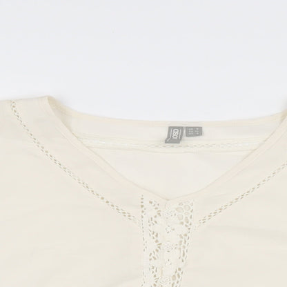 Close-up detail of ASOS women’s white polyester cropped blouse, size UK 8, v-neck