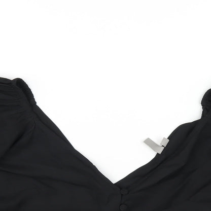 Close-up detail of ASOS women’s black polyester basic blouse, size UK 8, v-neck