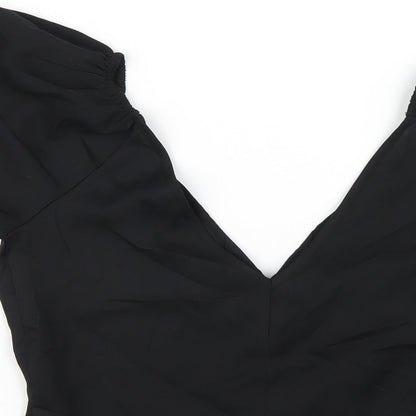 Brand and care label for ASOS women’s black polyester basic blouse, size UK 8, v-neck