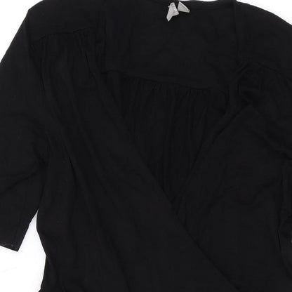 Close-up detail of ASOS women’s black viscose a-line, size UK 10, v-neck pullover