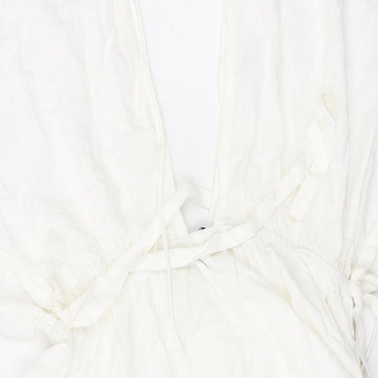 Brand and care label for ASOS women’s white viscose mini, size UK 6, v-neck pullover