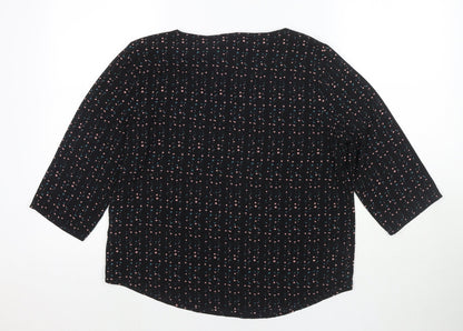 Back view of JDY women’s black polka dot polyester basic blouse, size UK 10, round neck