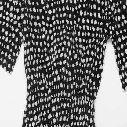 Close-up detail of ASOS women’s black geometric polyester a-line, size UK 8, round neck button