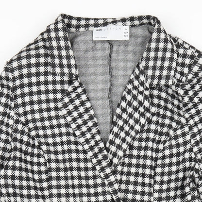 Close-up detail of ASOS women’s black check polyester jacket dress, size UK 12, collared button