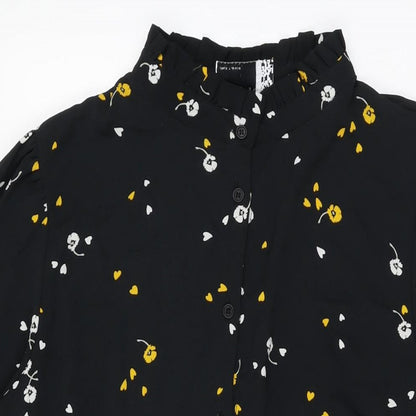 Close-up detail of ASOS women’s black floral polyester shift, size UK 18, round neck button