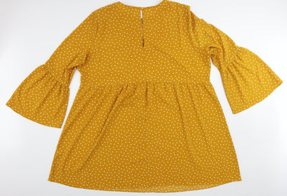Back view of ASOS women’s yellow polka dot polyester a-line, size UK 24, round neck button