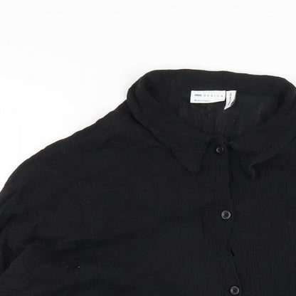 Close-up detail of ASOS women’s black cotton basic button-up, size UK 10, collared