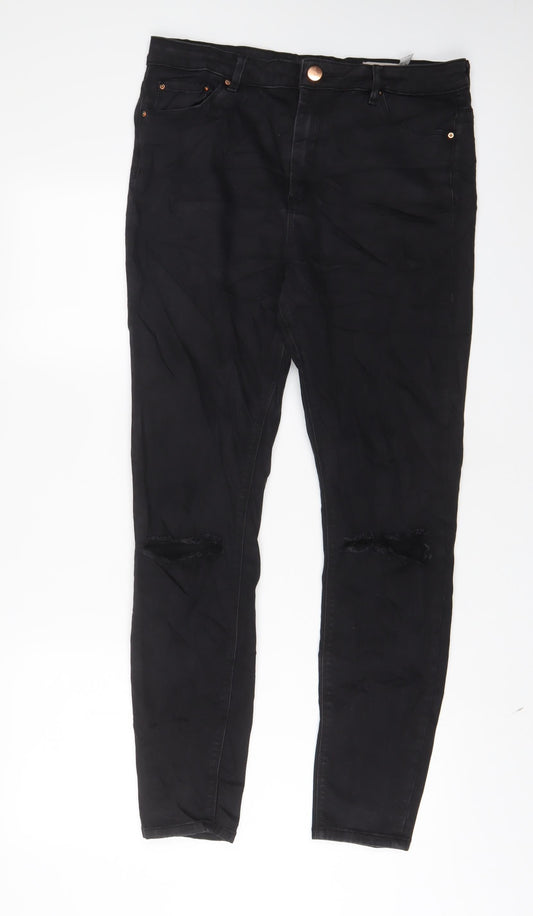 Front view of ASOS women’s black cotton skinny jeans, size UK 32, in, 34-inch leg regular zip