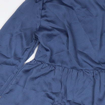 Brand and care label for Missguided women’s blue polyester shirt dress, size UK 12, collared button