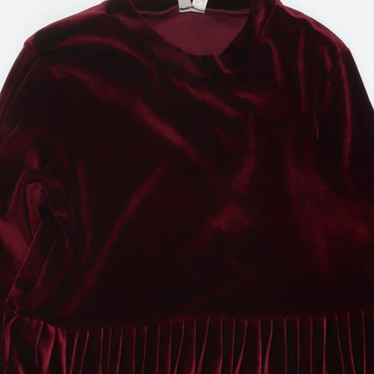 Close-up detail of ASOS women’s red polyester a-line, size UK 8, mock neck pullover