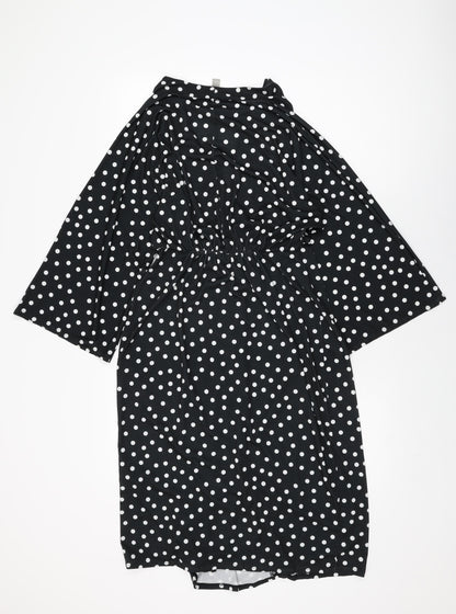 Back view of ASOS women’s black polka dot polyester shift, size UK 12, v-neck pullover