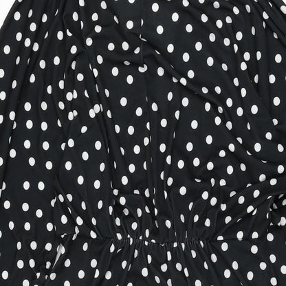 Brand and care label for ASOS women’s black polka dot polyester shift, size UK 12, v-neck pullover